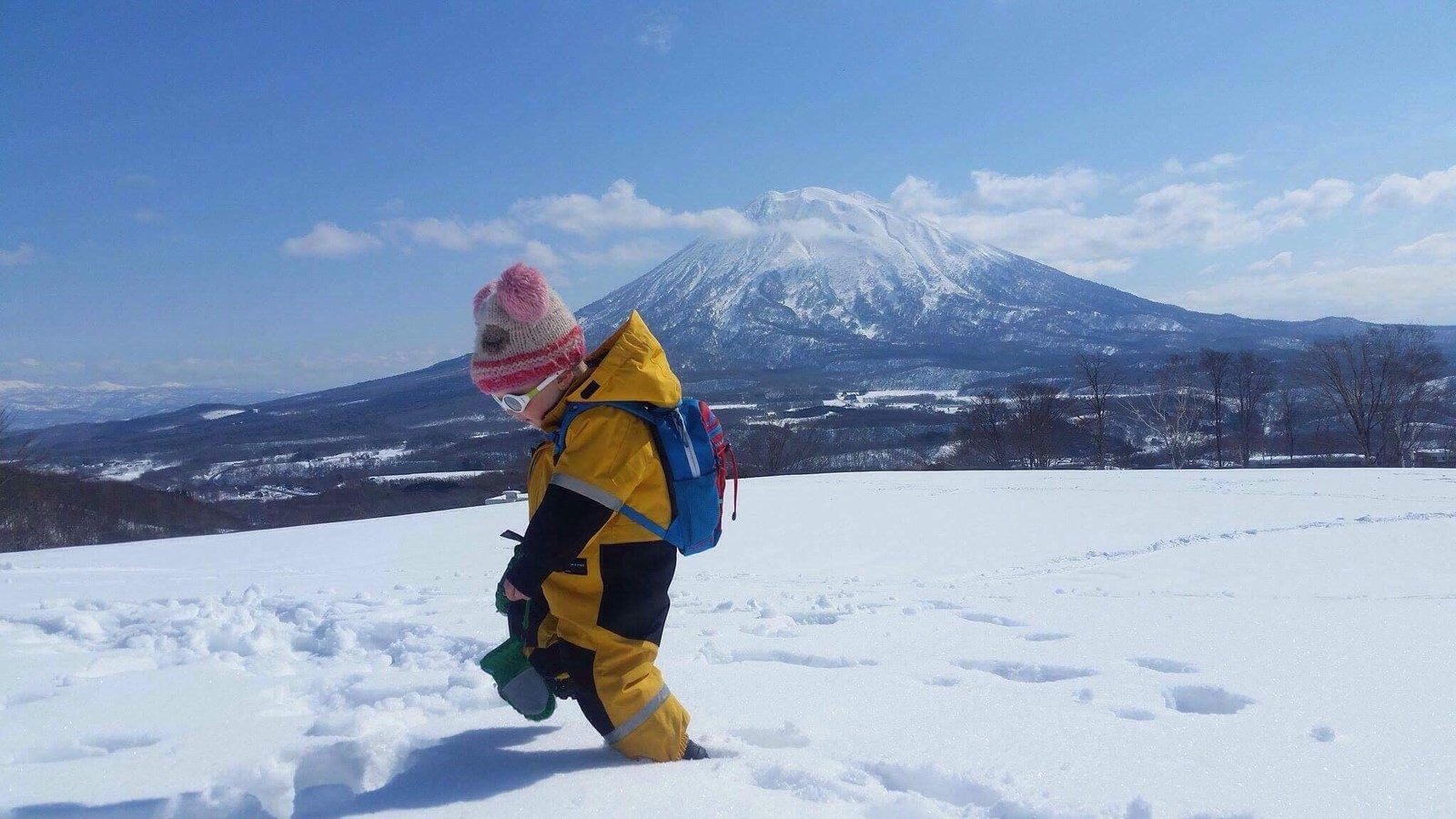 `toddler walking on snow